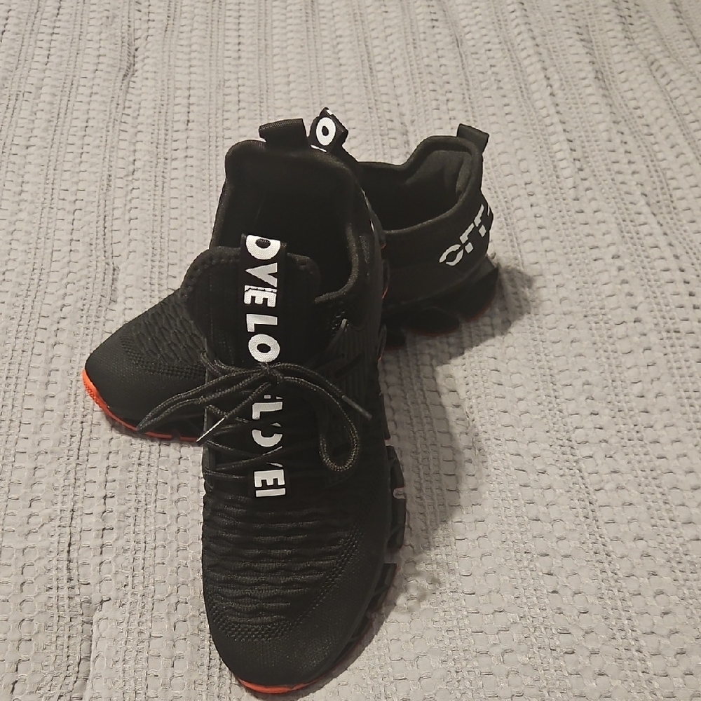 Black and White Sneakers with Red Accents